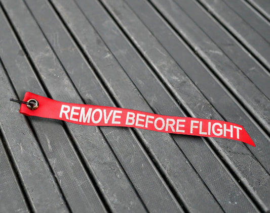 REMOVE BEFORE FLIGHT streamer (approx 1" x 8")